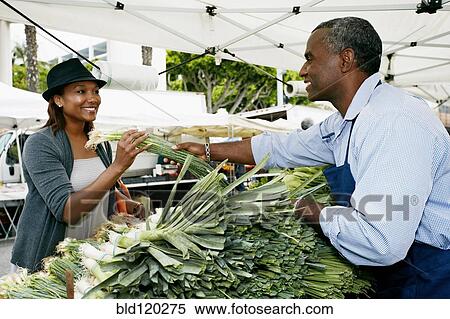 Black woman shopping at outdoor market View Large Photo Image Stock Photography - Black woman shopping at outdoor market. Fotosearch