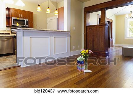 Bouquet of flowers and gift in new house View Large Photo Image Stock Photo - Bouquet of flowers and gift in new house. Fotosearch