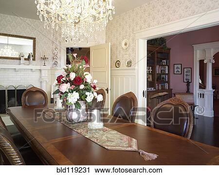 Stock Image - Bouquet of flowers on table in ornate dining room at Hulbert Mansion, Aberdeen, Washington, United States. Fotosearch