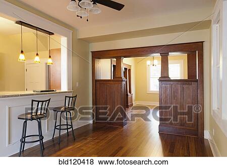 Stock Photo - Breakfast bar and entryway of house. Fotosearch