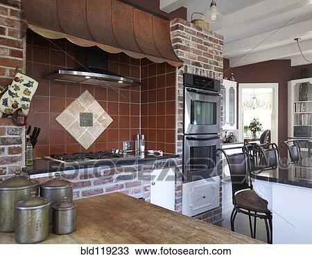 Stock Image - Brick wall in kitchen. Fotosearch