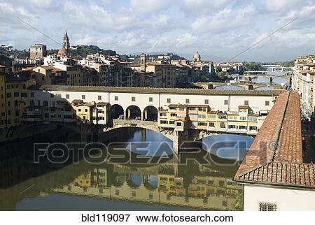 Stock Photo - Building on bridge over urban canal, Florence, Florence, Italy. Fotosearch