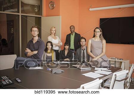 Stock Photography - Business people smiling in meeting. Fotosearch