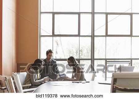 Business people talking in meeting View Large Photo Image Stock Photo - Business people talking in meeting. Fotosearch