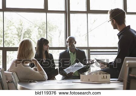 Business people talking in meeting View Large Photo Image Stock Photograph - Business people talking in meeting. Fotosearch