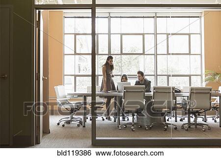 Stock Photograph - Business people talking in meeting. Fotosearch