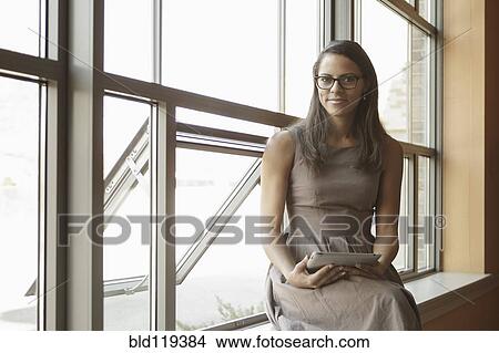 Businesswoman using tablet computer View Large Photo Image Picture - Businesswoman using tablet computer. Fotosearch