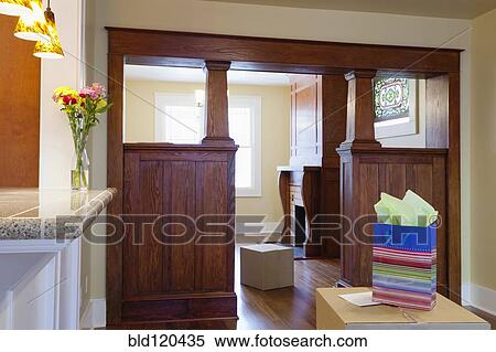 Stock Photography - Cardboard boxes and gift in new house. Fotosearch