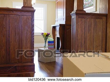 Stock Photograph - Cardboard boxes with gifts in new house. Fotosearch