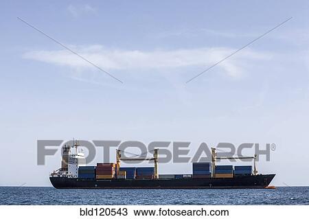 Cargo ship in ocean View Large Photo Image Stock Image - Cargo ship in ocean. Fotosearch