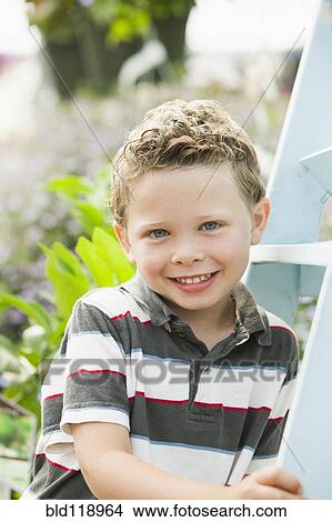 Picture - Caucasian boy smiling. Fotosearch