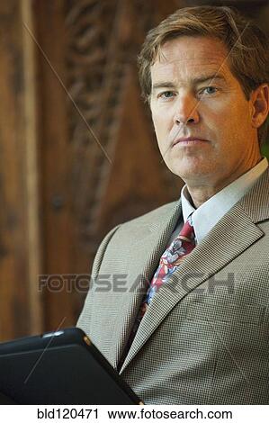 Caucasian businessman using digital tablet View Large Photo Image Stock Image - Caucasian businessman using digital tablet. Fotosearch