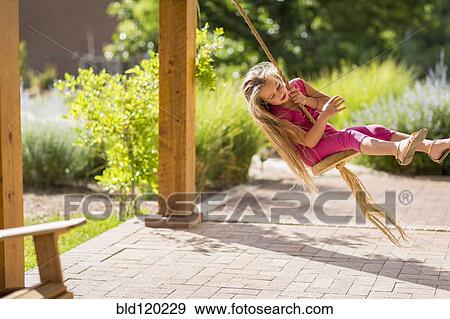 Caucasian girl on swing View Large Photo Image Stock Photo - Caucasian girl on swing. Fotosearch