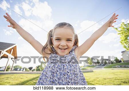 Caucasian girl playing outdoors View Large Photo Image Stock Photo - Caucasian girl playing outdoors. Fotosearch