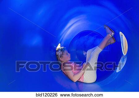 Caucasian girl sitting in plastic tunnel View Large Photo Image Stock Photograph - Caucasian girl sitting in plastic tunnel. Fotosearch