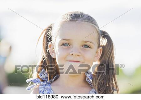 Caucasian girl smiling outdoors View Large Photo Image Stock Image - Caucasian girl smiling outdoors. Fotosearch