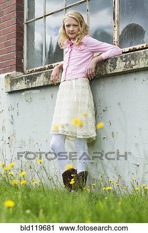 Stock Image - Caucasian girl smiling outdoors. Fotosearch