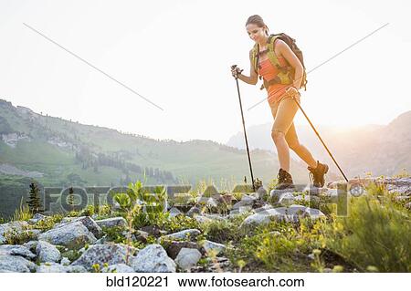 Caucasian woman hiking on rocky trail View Large Photo Image Stock Image - Caucasian woman hiking on rocky trail. Fotosearch