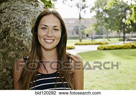 Caucasian woman smiling outdoors View Large Photo Image Stock Image - Caucasian woman smiling outdoors. Fotosearch