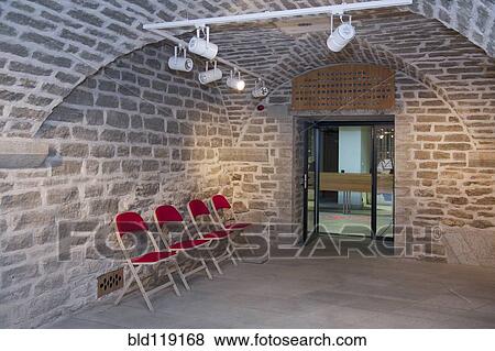 Stock Photo - Chairs in brick entrance of lecture hall, Tartu University, Tartu, Estonia. Fotosearch