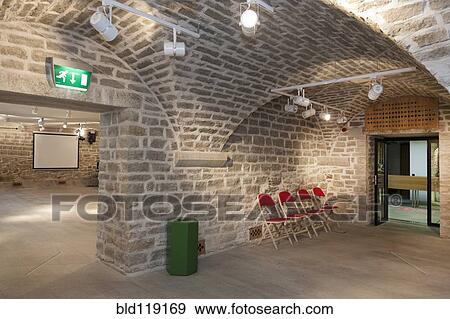 Stock Photo - Chairs in brick entrance of lecture hall, Tartu University, Tartu, Estonia. Fotosearch