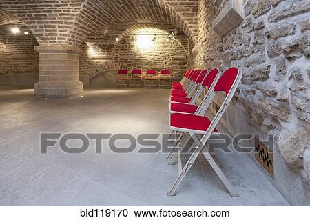 Stock Image - Chairs in brick lecture hall, Tartu University, Tartu, Estonia. Fotosearch