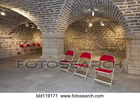 Stock Image - Chairs in brick lecture hall, Tartu University, Tartu, Estonia. Fotosearch