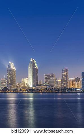 Stock Image - City skyline lit up at night, San Diego, California, United States. Fotosearch