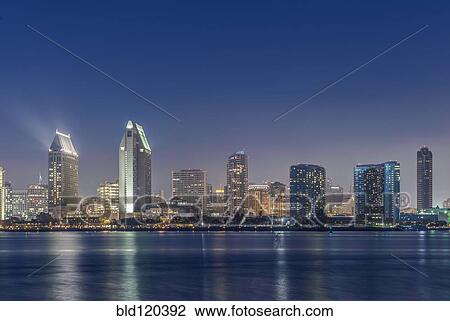 Stock Image - City skyline lit up at night, San Diego, California, United States. Fotosearch
