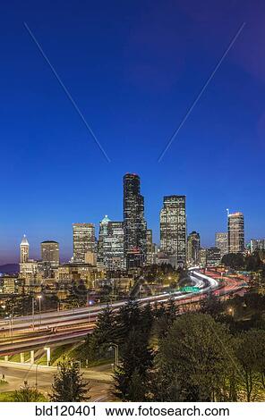 Stock Image - City skyline lit up at night, Seattle, Washington, United States. Fotosearch
