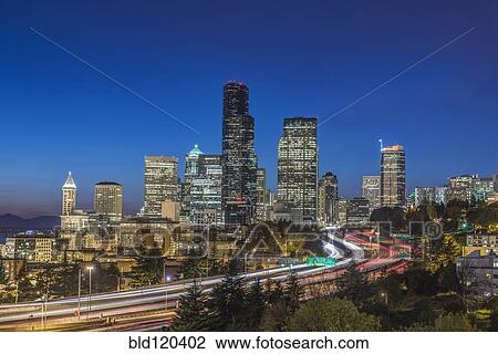 Stock Image - City skyline lit up at night, Seattle, Washington, United States. Fotosearch