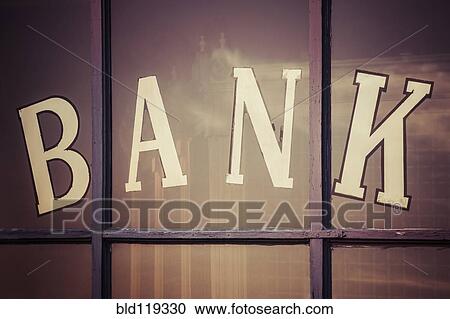 Stock Image - Close up of "bank" written on window panes. Fotosearch