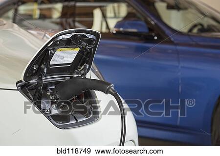 Close up of electric car charger View Large Photo Image Stock Photo - Close up of electric car charger. Fotosearch