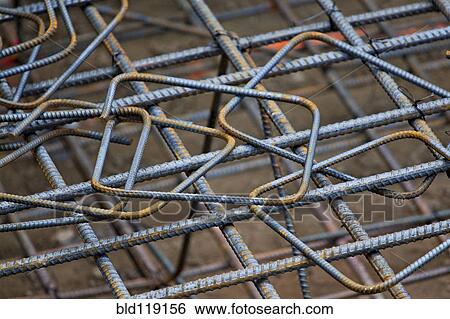 Stock Photograph - Close up of metal chain links and rebar. Fotosearch