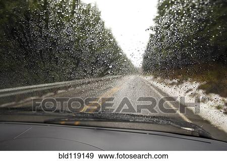 Stock Photo - Close up of rain on car windshield. Fotosearch
