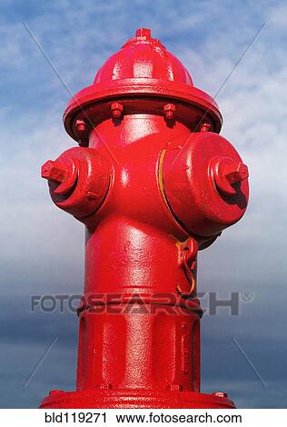 Stock Image - Close up of red fire hydrant. Fotosearch