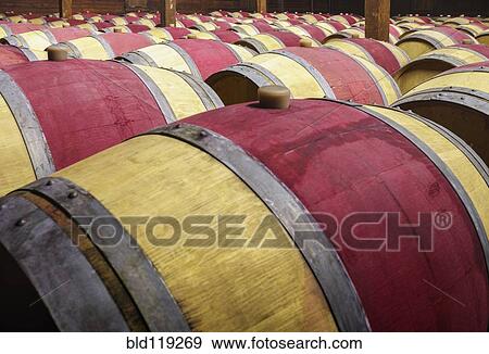 Close up of wine barrels in cellar View Large Photo Image Stock Photo - Close up of wine barrels in cellar. Fotosearch
