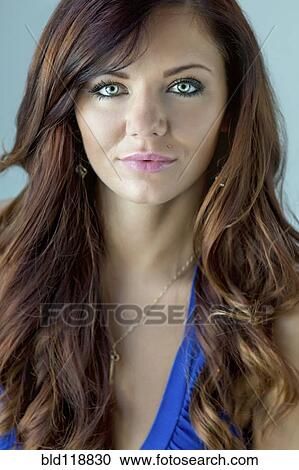 Stock Image - Close up of woman's serious face. Fotosearch