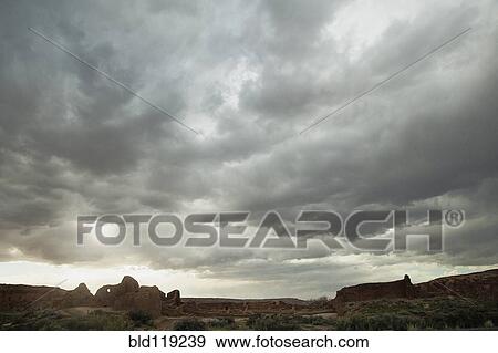Stock Photo - Cloudy sky over rock formations, Chaco Canyon, New Mexico, United States. Fotosearch