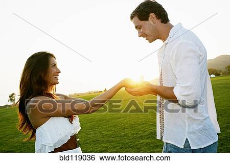 Couple talking in park View Large Photo Image Stock Photograph - Couple talking in park. Fotosearch