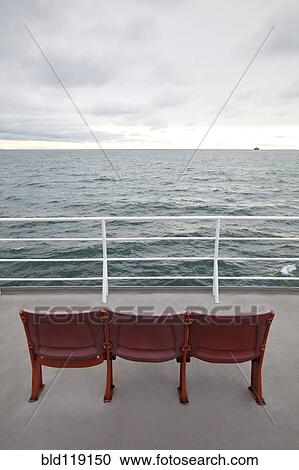 Empty chairs on ferry deck View Large Photo Image Stock Image - Empty chairs on ferry deck. Fotosearch