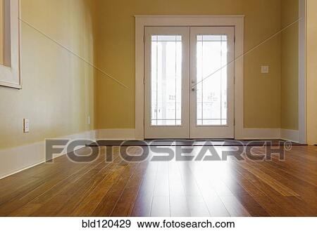 Stock Photo - French doors and hardwood floors in new house. Fotosearch