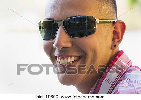 Stock Image - Hispanic boy smiling outdoors. Fotosearch