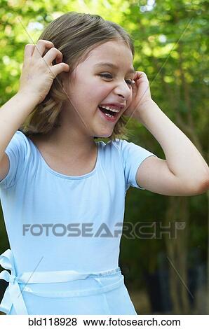 Hispanic girl laughing outdoors View Large Photo Image Stock Photo - Hispanic girl laughing outdoors. Fotosearch