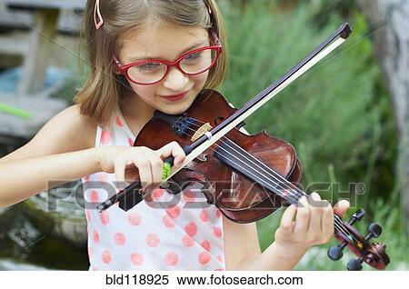 Hispanic girl playing violin outdoors View Large Photo Image Stock Photography - Hispanic girl playing violin outdoors. Fotosearch