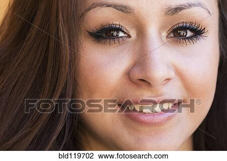 Stock Image - Hispanic girl smiling. Fotosearch
