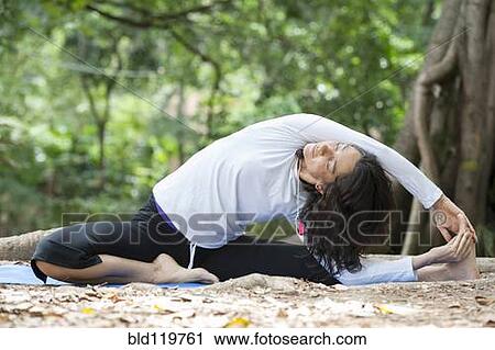 Hispanic woman practicing yoga View Large Photo Image Stock Image - Hispanic woman practicing yoga. Fotosearch