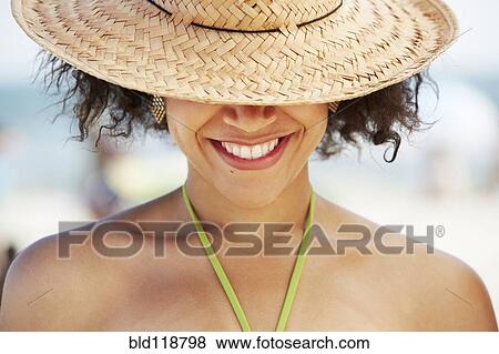 Hispanic woman smiling on beach View Large Photo Image Stock Photo - Hispanic woman smiling on beach. Fotosearch