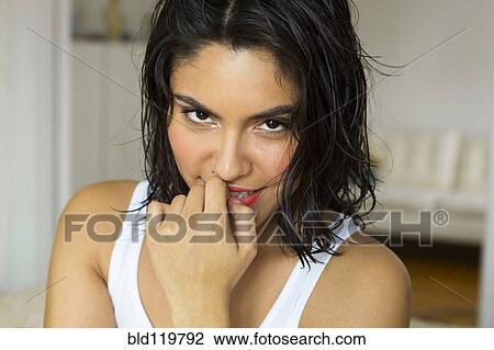 Stock Image - Hispanic woman smiling. Fotosearch