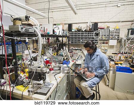 Stock Photo - Indian scientist working in laboratory. Fotosearch